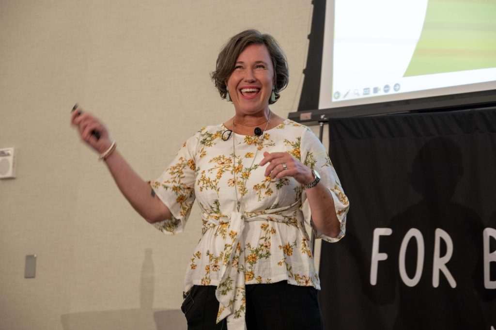 Tracey McBeath speaking on stage